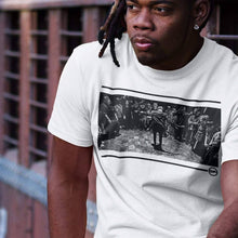 Load image into Gallery viewer, a young man with locks hair sitting on a rail wearing a tokyo bop t-shirt