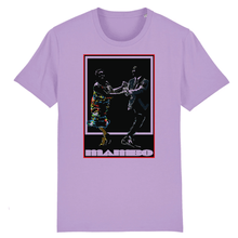 Load image into Gallery viewer, Lavender-color-t-shirt-on-a--flat-a-print-on-the-front-with-a-couple-dancing-and-at-the-bottom-is-text-it-says-mambo
