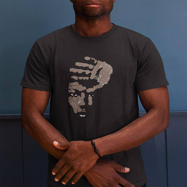 a man standing wearing a round neck opusdefunk watching t-shirt with crossed hands