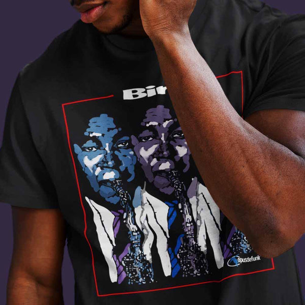 man-wearing-black-t-shirt-with-graphic-with-guy-blowing-a-saxophone-the-front