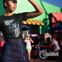 Load image into Gallery viewer, girl-wearing-a-black-t-shirt-with-saxophone-player-on-the-front
