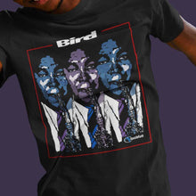 Load image into Gallery viewer, man-wearing-black-t-shirt-with-graphic-with-guy-blowing-a-saxophone-the-front
