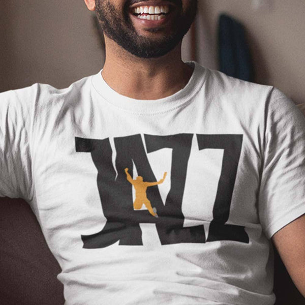 guy wearing white  jazz t-shirt 