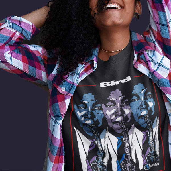 girl-wearing-black-t-shirt-with-graphic-with-guy-blowing-a-saxophone-the-front
