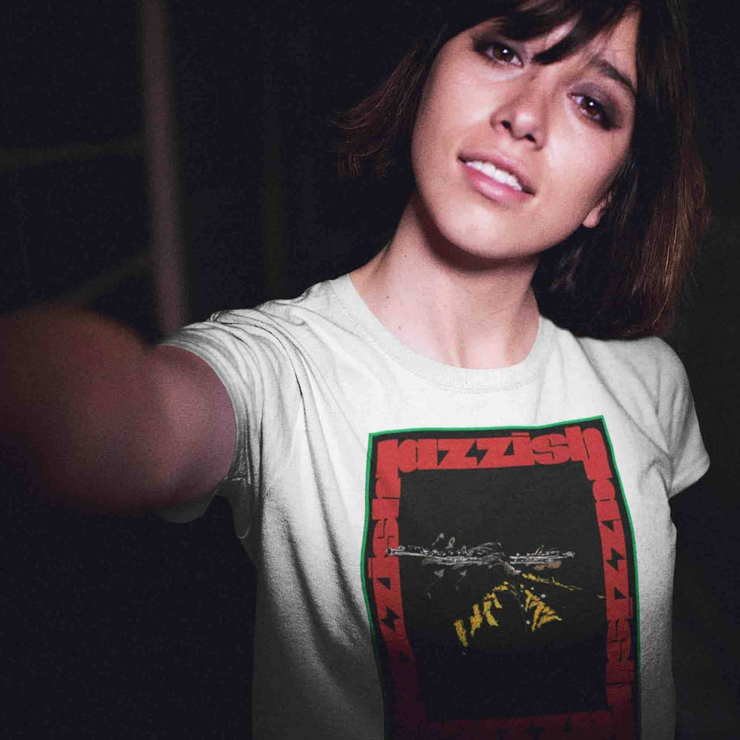 pretty young girl taking a selfie with short hair wearing a jazzflute t-shirt while in the city at night.jpg