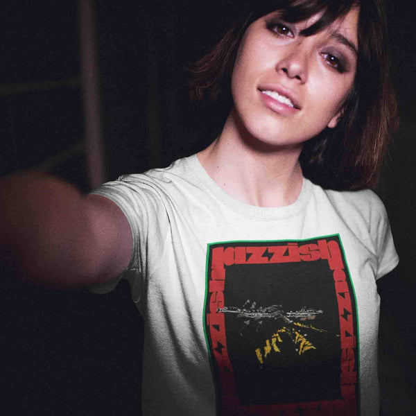pretty young girl taking a selfie with short hair wearing a jazzflute t-shirt while in the city at night.jpg