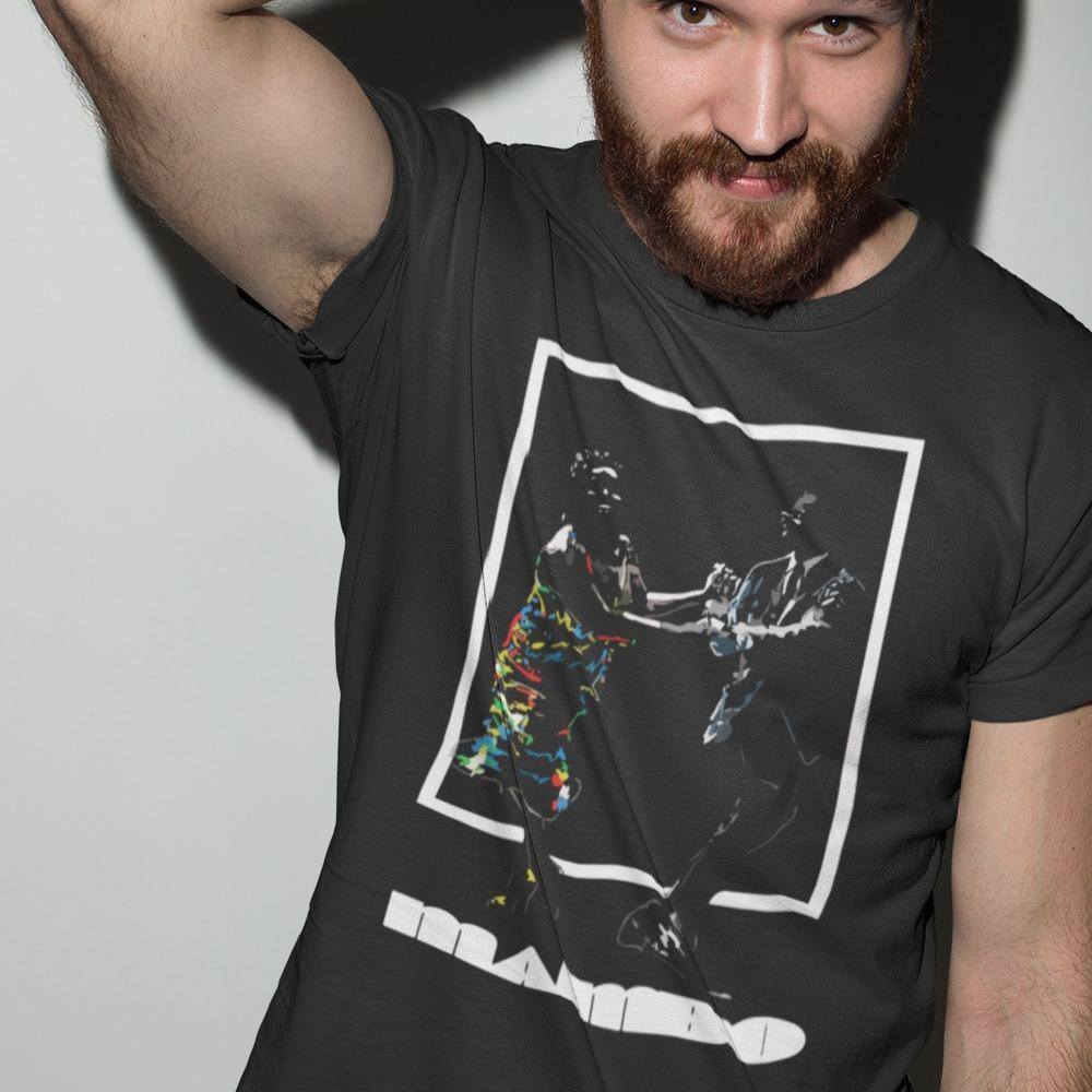 red haired man wearing a mambo4 tshirt in a studio