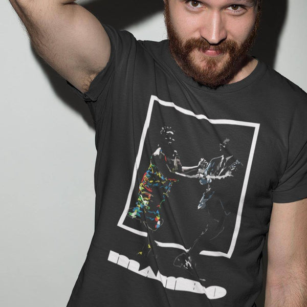 red haired man wearing a mambo4 tshirt in a studio